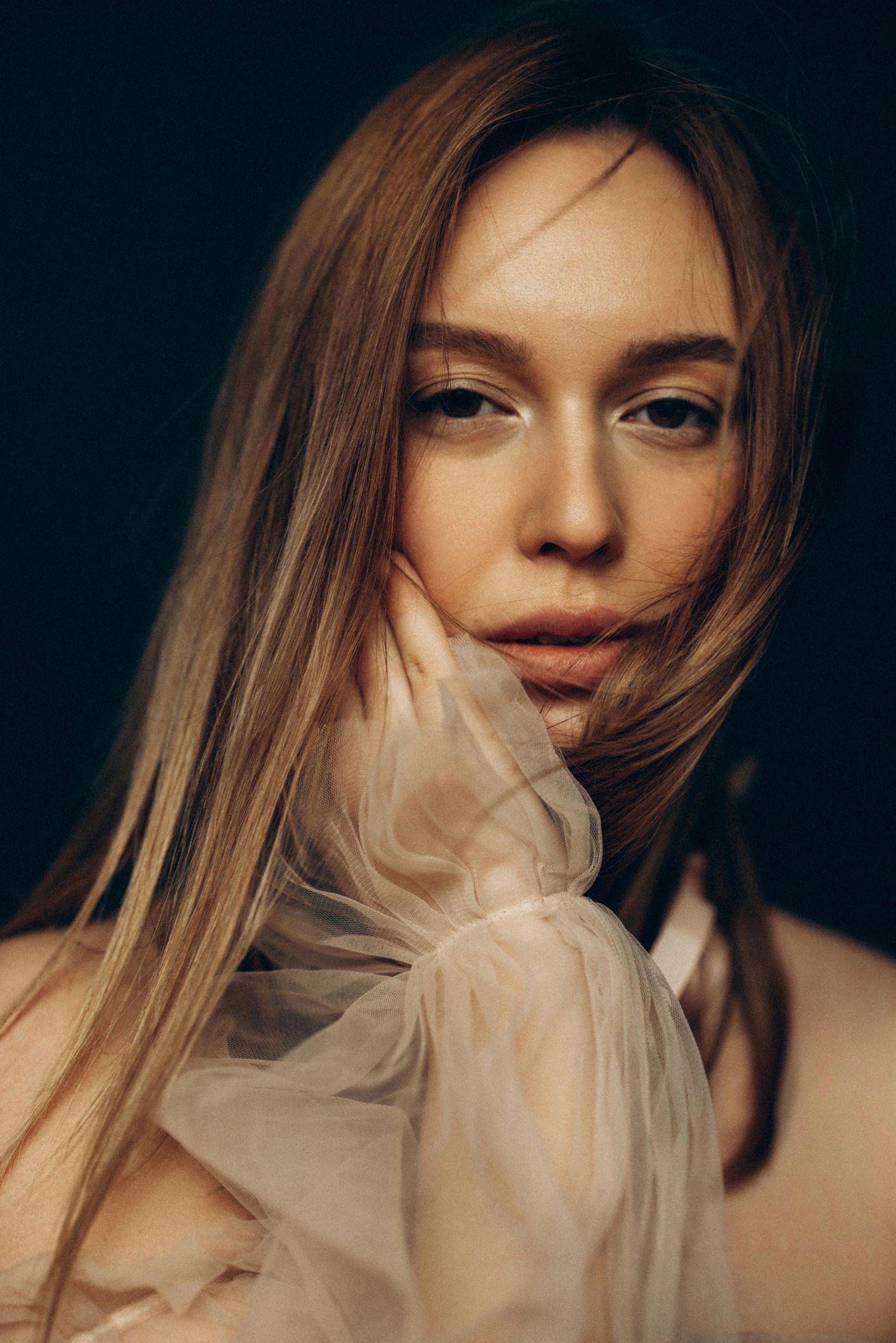 Editorial portrait in moody lighting