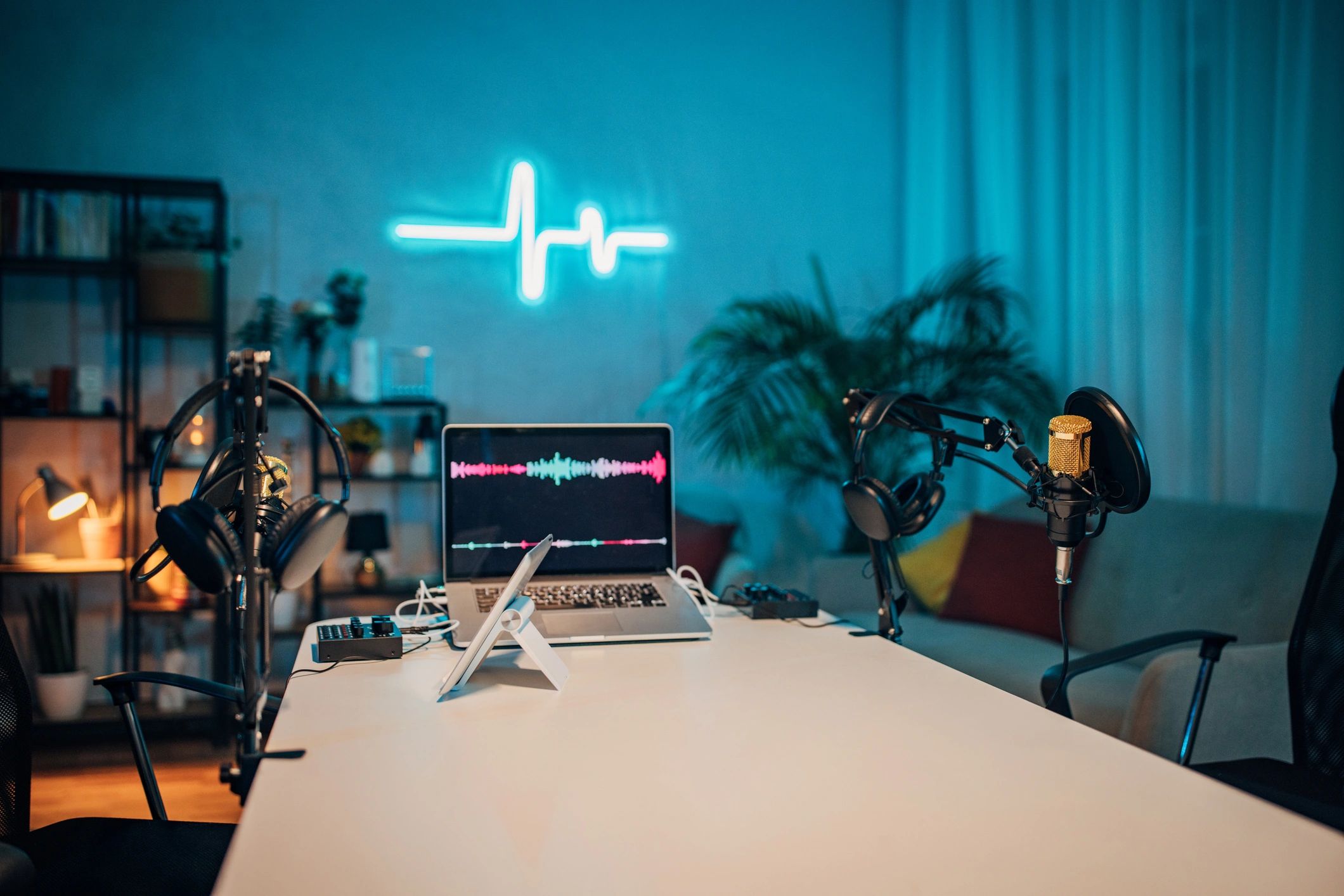 Moody podcast studio setup with microphone and chairs